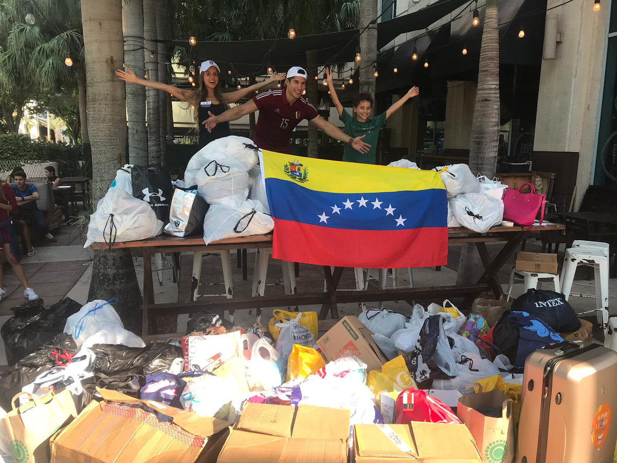 Chyno y Tashie superan expectativas en su primera recolecta de ropa de Miami a Petare